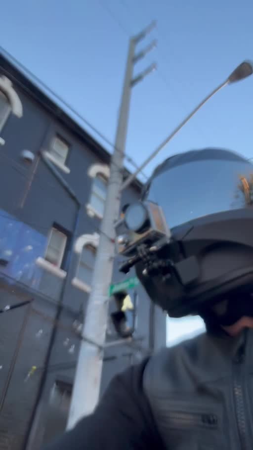 Helmet-on MotoPsycho Media rider on the road